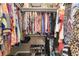 Organized walk-in closet with clothing racks and shoe storage at 3880 Sw 6Th Ave, Ocala, FL 34471