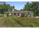 Charming single-story home with a well-manicured lawn and mature landscaping, showcasing excellent curb appeal at 3880 Sw 6Th Ave, Ocala, FL 34471