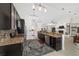 Well-equipped kitchen with stainless steel appliances, granite countertops, and dark wood cabinetry at 3880 Sw 6Th Ave, Ocala, FL 34471