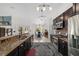 Open Kitchen features granite counters, stainless appliances, and lighting at 3880 Sw 6Th Ave, Ocala, FL 34471