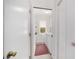 Bright laundry room with a window, white washer and dryer, and access to storage at 3880 Sw 6Th Ave, Ocala, FL 34471
