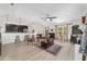 Open-concept living room with wood flooring and updated kitchen at 3880 Sw 6Th Ave, Ocala, FL 34471