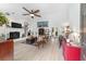 Large living room with wood flooring, a fireplace with hearth, and bright natural light at 3880 Sw 6Th Ave, Ocala, FL 34471
