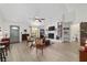 Spacious living room with light floors, white brick fireplace, and plenty of seating space at 3880 Sw 6Th Ave, Ocala, FL 34471