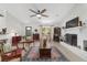 Inviting living room with white brick fireplace, light wood floors, and comfortable furnishings at 3880 Sw 6Th Ave, Ocala, FL 34471