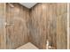 Close up of the tiled shower in the bathroom with a corner shelf at 3880 Sw 6Th Ave, Ocala, FL 34471