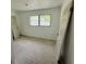 Bedroom ready for renovation features natural light through a large window to create an inviting space at 4000 Sw 6Th Ave, Ocala, FL 34471