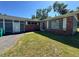 Charming single story home with red brick and a well-manicured lawn on a sunny day at 4000 Sw 6Th Ave, Ocala, FL 34471