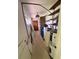 Hallway with shelving for storage and utility space, suitable for renovation at 4000 Sw 6Th Ave, Ocala, FL 34471