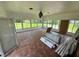 Spacious sunroom featuring tile flooring and many windows providing natural light at 4000 Sw 6Th Ave, Ocala, FL 34471