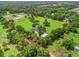 Aerial view of a large estate with mature trees surrounded by fencing at 402 Sw 127Th Pl, Ocala, FL 34473