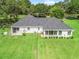 Aerial view of the home with a large, well-maintained backyard and mature landscaping at 402 Sw 127Th Pl, Ocala, FL 34473