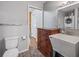 Bathroom features a utility sink and a doorway leading to a back porch at 402 Sw 127Th Pl, Ocala, FL 34473