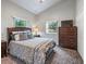 Serene bedroom featuring a comfortable bed, ample natural light, and a spacious closet for storage at 402 Sw 127Th Pl, Ocala, FL 34473