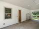 Spacious carport with white-washed walls, a storage area, and a view of the outdoor patio at 402 Sw 127Th Pl, Ocala, FL 34473