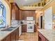 Well-appointed kitchen with a marble countertops, stainless steel sink, and modern appliances at 402 Sw 127Th Pl, Ocala, FL 34473