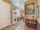Convenient laundry room with stackable washer/dryer, custom cabinets, and adjacent to the hall bathroom at 402 Sw 127Th Pl, Ocala, FL 34473