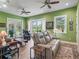 Bright living room with hardwood floors and many windows allowing natural light to flood in at 402 Sw 127Th Pl, Ocala, FL 34473