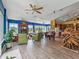 Spacious living room with an open floor plan featuring a fireplace and dining area at 402 Sw 127Th Pl, Ocala, FL 34473