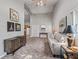 Cozy living space with comfortable seating, modern decor, and seamless flow into the kitchen area at 402 Sw 127Th Pl, Ocala, FL 34473