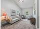 Bright living room showcasing modern furniture, neutral tones, and natural light from multiple windows at 402 Sw 127Th Pl, Ocala, FL 34473