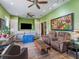 Bright living room with hardwood floors and many windows allowing natural light to flood in at 402 Sw 127Th Pl, Ocala, FL 34473