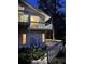 Exterior view of the home with a lighted balcony and backyard at 4305 Sw 20Th Ave, Ocala, FL 34471