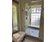 Bright bathroom featuring an updated tile shower with window and glass door at 4305 Sw 20Th Ave, Ocala, FL 34471