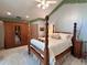 Bright bedroom with four-poster bed and large wardrobe at 4305 Sw 20Th Ave, Ocala, FL 34471