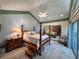 Spacious bedroom with four-poster bed, mirrored closet, and access to the outdoors at 4305 Sw 20Th Ave, Ocala, FL 34471