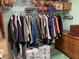 Hanging storage and wooden dresser in a walk-in closet with organizers at 4305 Sw 20Th Ave, Ocala, FL 34471