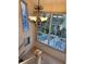 Foyer with large windows, high ceilings, and decorative chandelier at 4305 Sw 20Th Ave, Ocala, FL 34471