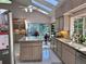 Spacious kitchen featuring large island, granite countertops, modern appliances, and natural light at 4305 Sw 20Th Ave, Ocala, FL 34471