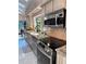 Modern kitchen featuring stainless steel appliances, granite countertops, and lots of natural light at 4305 Sw 20Th Ave, Ocala, FL 34471