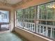 Light-filled sunroom with large windows offering scenic views of the outdoor greenery at 4305 Sw 20Th Ave, Ocala, FL 34471