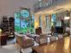 Spacious living room features high ceilings, stained glass window, spiral staircase, and a fireplace at 4305 Sw 20Th Ave, Ocala, FL 34471