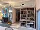 Bright living room with fireplace and built-in shelving in an open layout at 4305 Sw 20Th Ave, Ocala, FL 34471