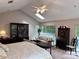 Spacious bedroom with vaulted ceilings, skylight, sitting area, and dark wood accents at 4305 Sw 20Th Ave, Ocala, FL 34471