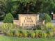 Attractive community entrance sign for Oak Creek Caverns surrounded by beautiful landscaping at 4305 Sw 20Th Ave, Ocala, FL 34471