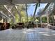 Large sunroom with skylights and walls of windows overlooking the lush, wooded property at 4305 Sw 20Th Ave, Ocala, FL 34471