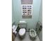Traditional-style bathroom featuring a mint green toilet, bidet, and framed wall art at 4305 Sw 20Th Ave, Ocala, FL 34471