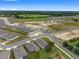 Bird's-eye view of a residential area with new construction, showcasing community layout and green spaces at 4892 Nw 39Th Loop, Ocala, FL 34482