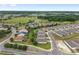 This aerial showcases homes in a tranquil community surrounded by lush landscaping and mature trees at 4892 Nw 39Th Loop, Ocala, FL 34482