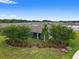 Overhead view of a home's backyard featuring a patio, landscaping, and a serene view at 4892 Nw 39Th Loop, Ocala, FL 34482