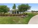 The backyard offers a screened lanai for outdoor enjoyment, surrounded by mature trees and a well-manicured lawn at 4892 Nw 39Th Loop, Ocala, FL 34482