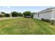 A well maintained lawn surrounds a single-story home with attached garage at 4892 Nw 39Th Loop, Ocala, FL 34482