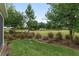 Lush green backyard with well-maintained grass and mature trees at 4892 Nw 39Th Loop, Ocala, FL 34482