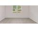 Bedroom featuring a window, tile flooring, and neutral paint at 4892 Nw 39Th Loop, Ocala, FL 34482