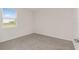 Clean bedroom with plush carpet and ample light from the window at 4892 Nw 39Th Loop, Ocala, FL 34482