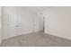 Carpeted bedroom featuring neutral walls, closet, and bright natural light at 4892 Nw 39Th Loop, Ocala, FL 34482
